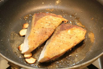 hamachi cooking in a frying pan