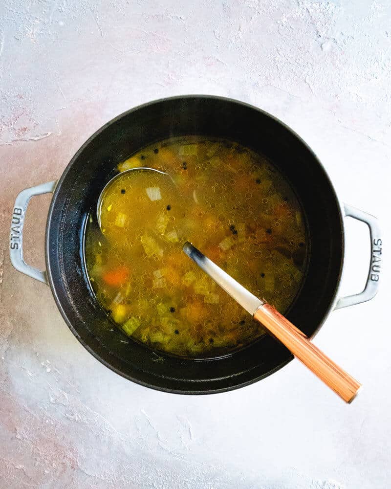 Homemade Vegetable Broth | Veggie broth in a Dutch oven