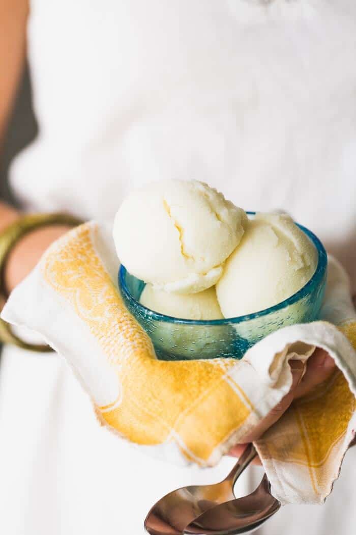 Lemon gelato in bowl with spoons
