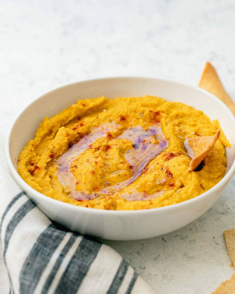 Pumpkin hummus topped with a drizzle of olive oil and paprika