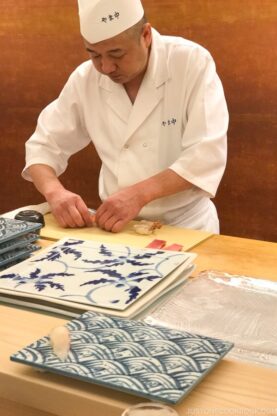 chef preparing sushi at Sushi Yamanaka - Fukuoka Travel Guide | fancyfoodsshow.com