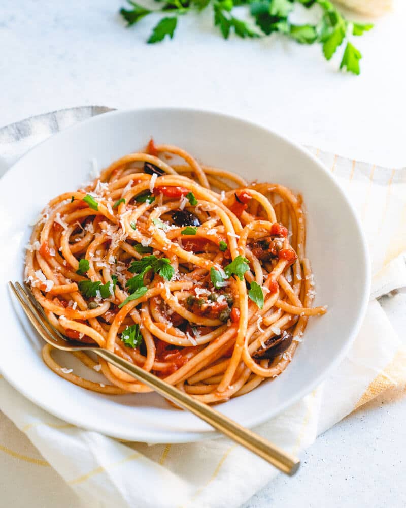 vegetarian pasta in white bowl with fork