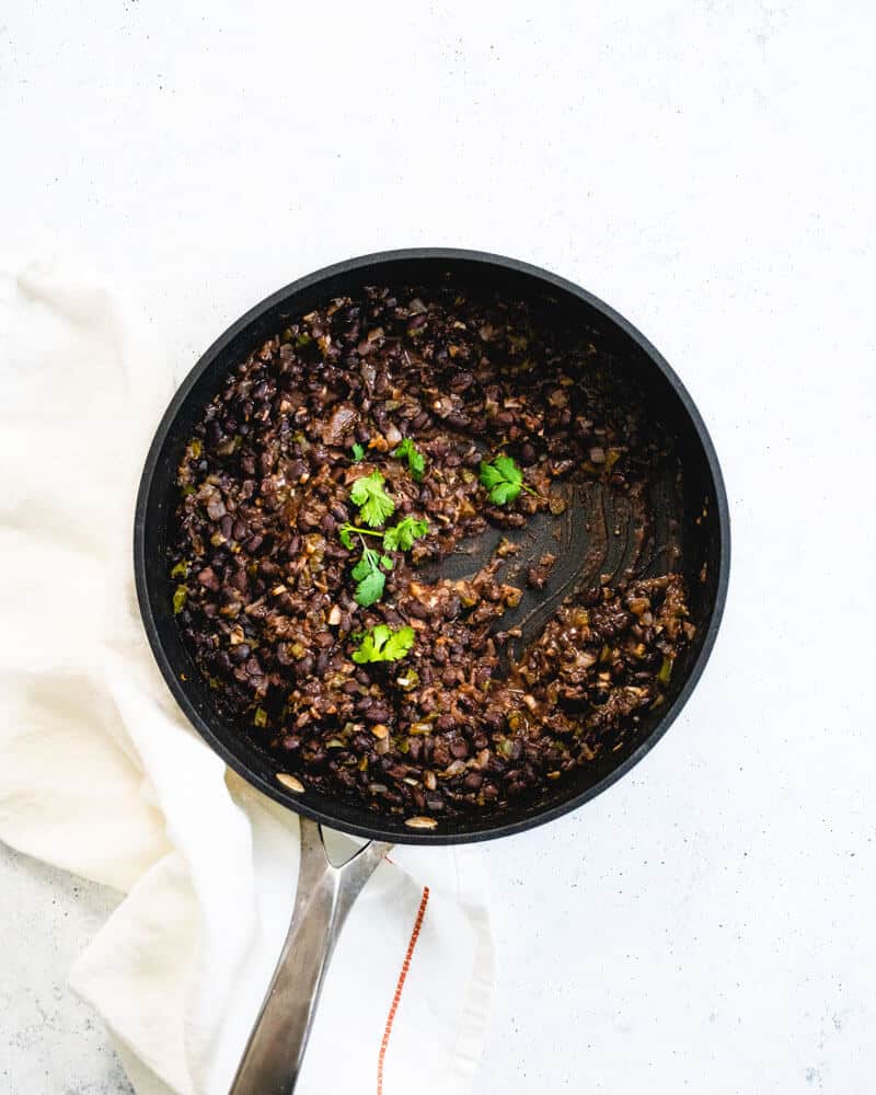 Cuban black beans in metal skillet