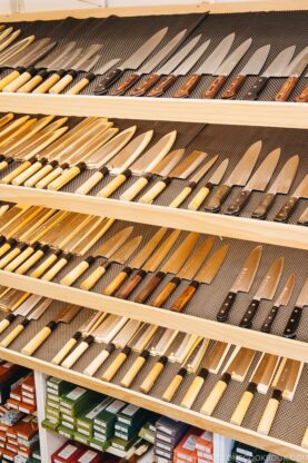 Japanese knives on a shelf.