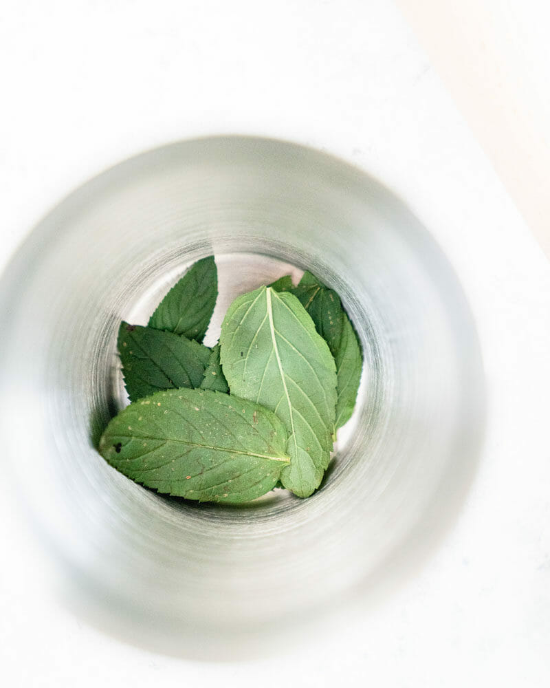 a bowl with mint leaves