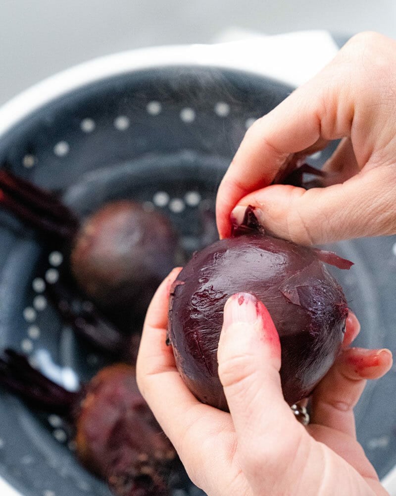 Peeling the skin off baked beets 