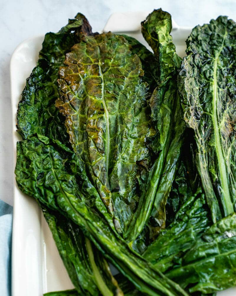 Grilled kale on platter. 