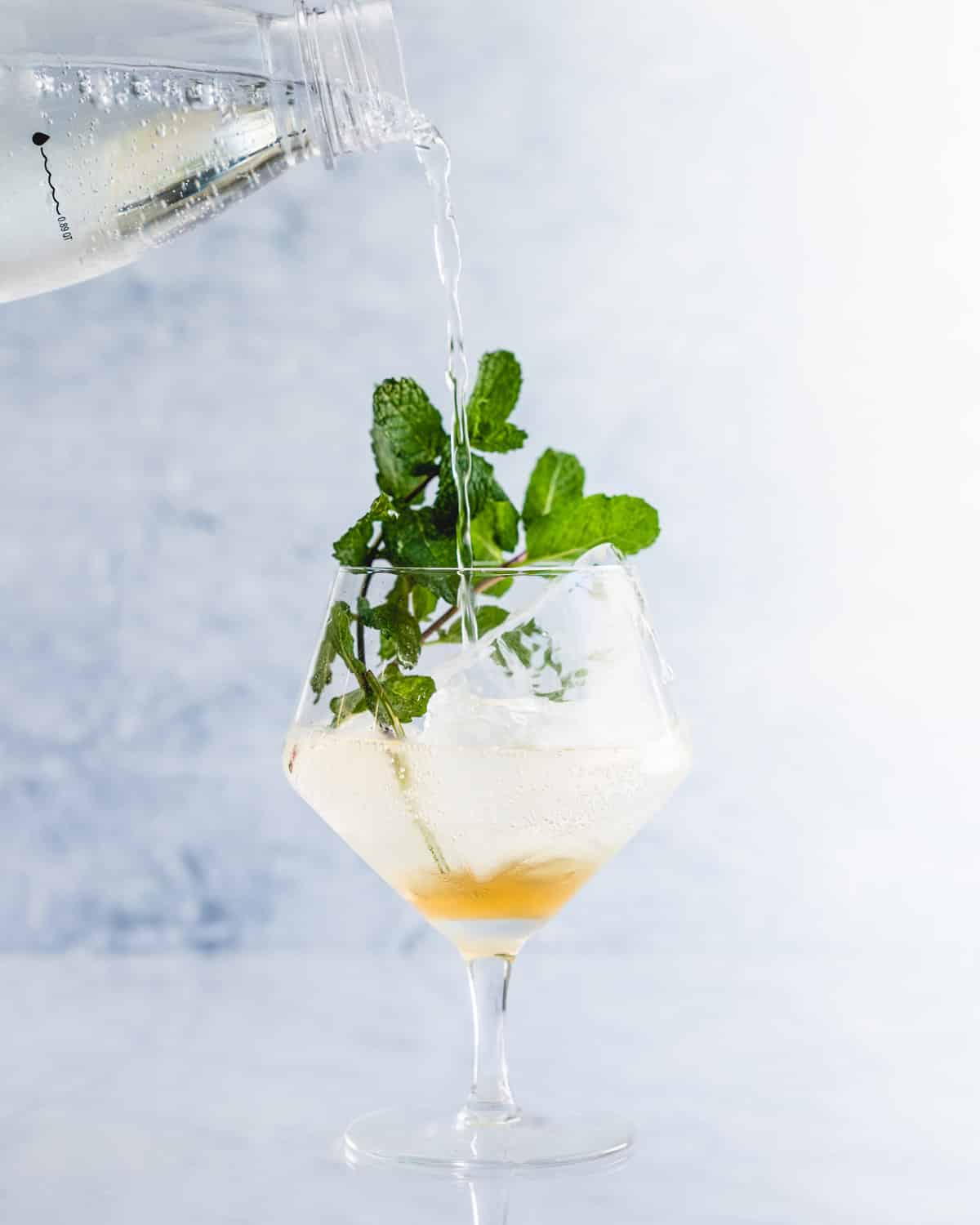 Step 2: Add soda water and garnish with mint.