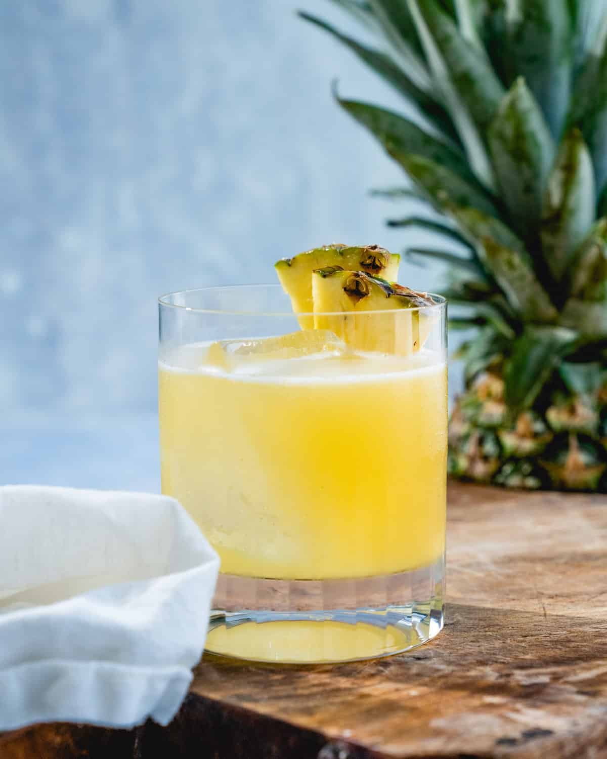Pineapple Margarita in rocks glass with pineapple garnish.