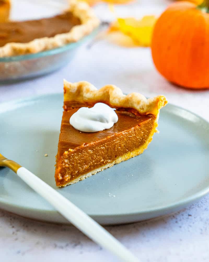 Vegan pumpkin pie on plate with fork