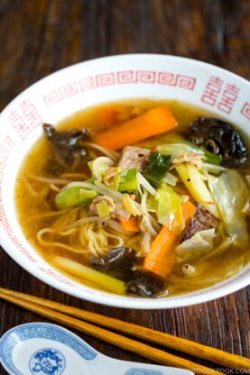 A ramen bowl containing tan men.