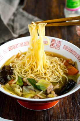 A ramen bowl containing tan men.