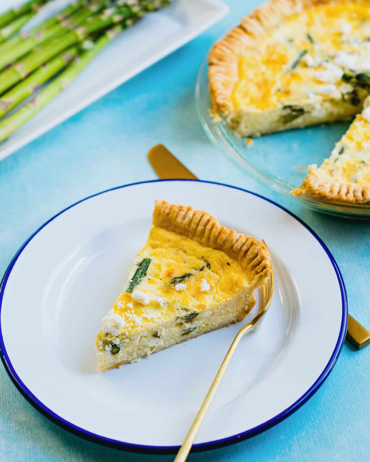 Asparagus Quiche slice with fork.