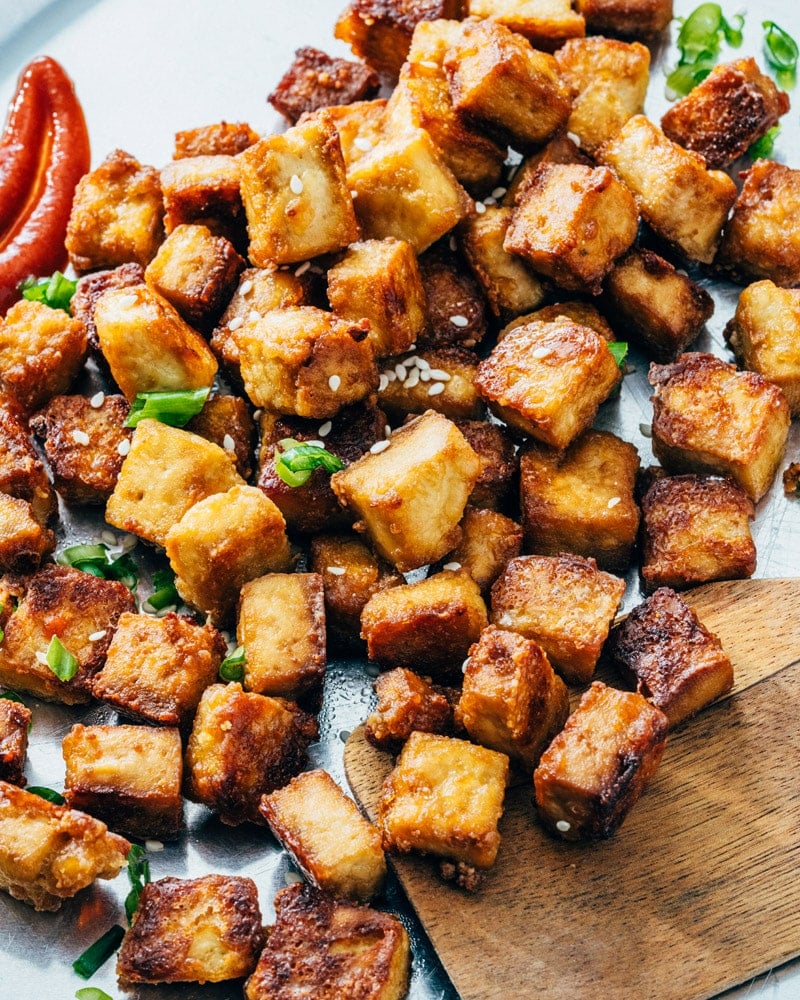 Baked Tofu recipe on a baking sheet with spatula.