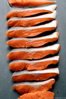 Step by step instructions on how to cut half a salmon into thin Japanese-style fillets.