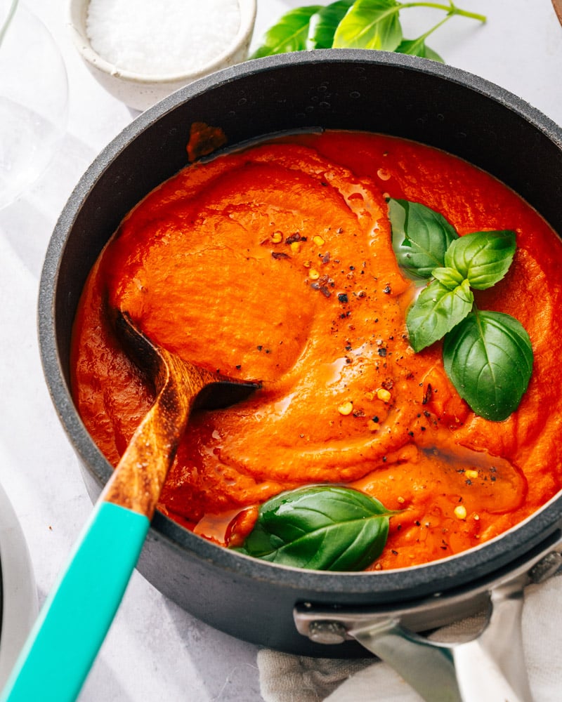 Red Sauce in a bowl, topped with fresh basil