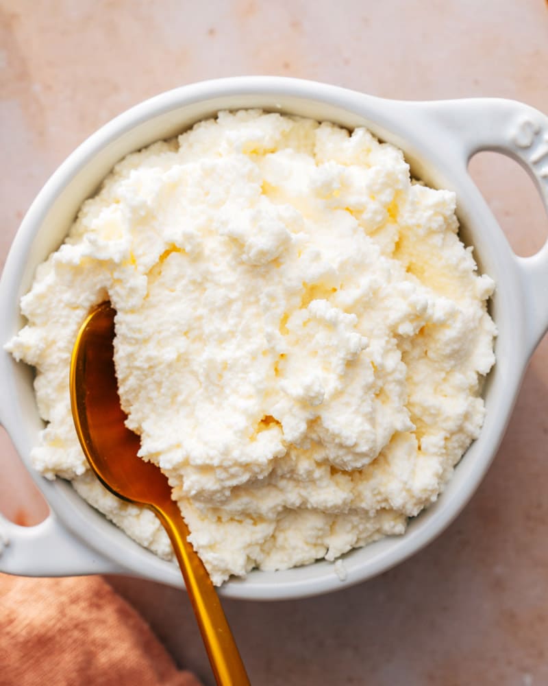 Bowl of frozen ricotta cheese with a spoon