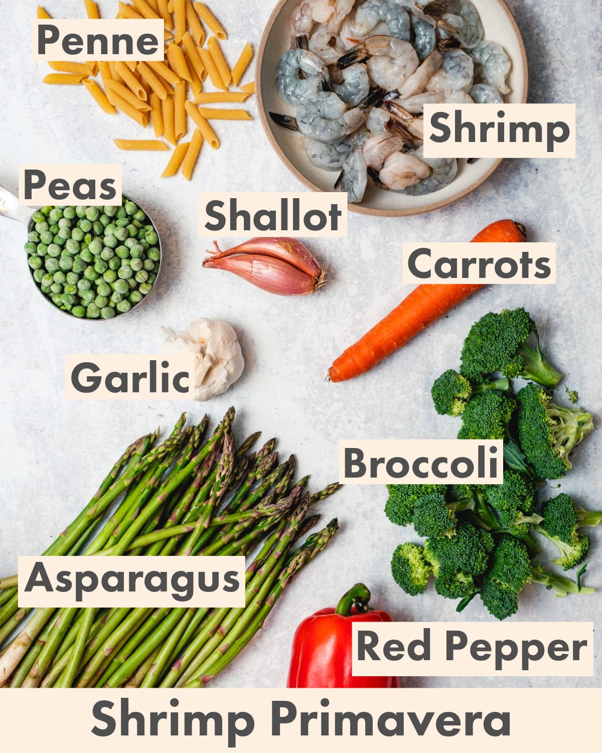 Shrimp primavera ingredients: pasta, shrimp, peas, shallot, carrots, garlic, asparagus, broccoli, red pepper.