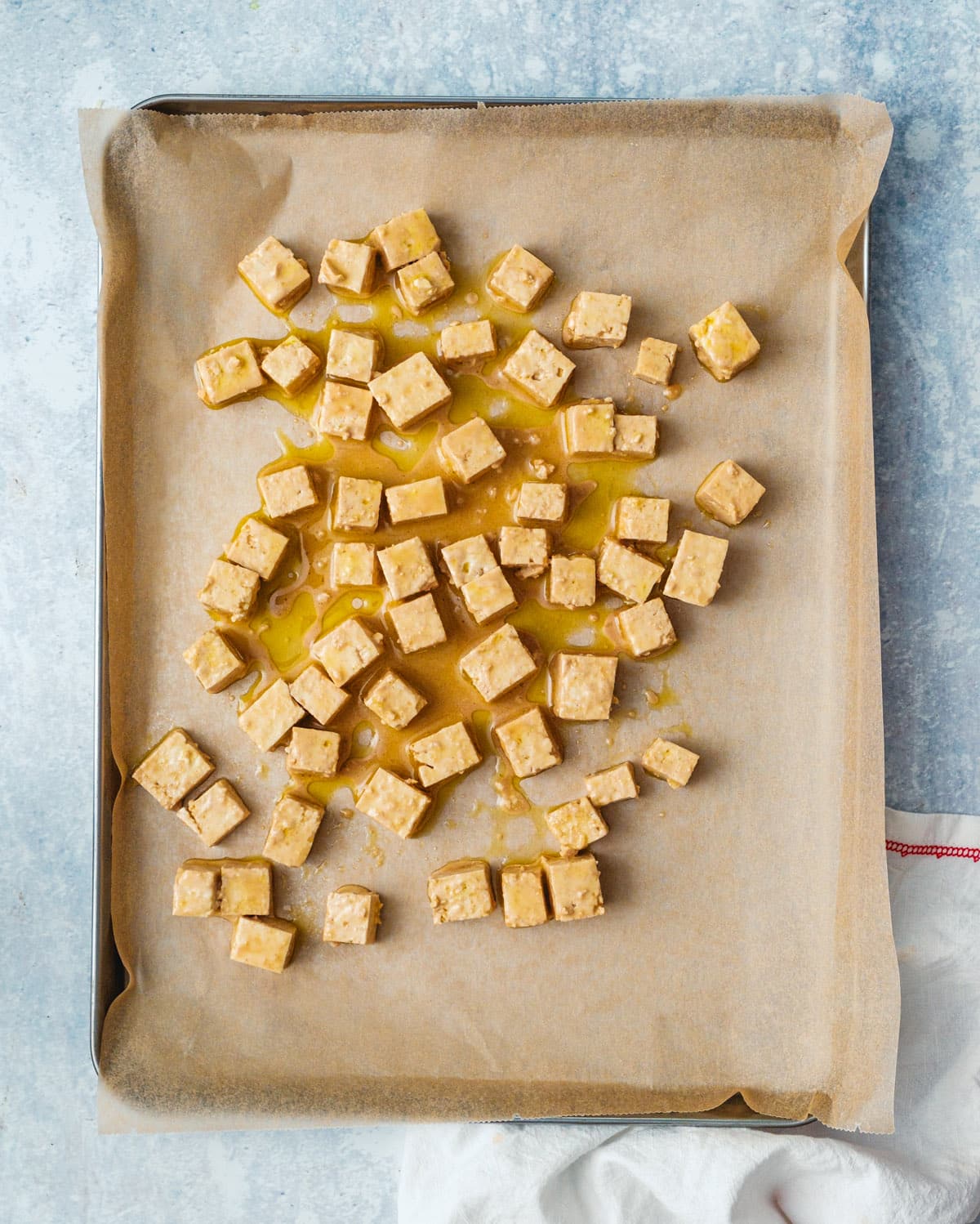 Step 3: Place the tofu on a parchment lined baking sheet.