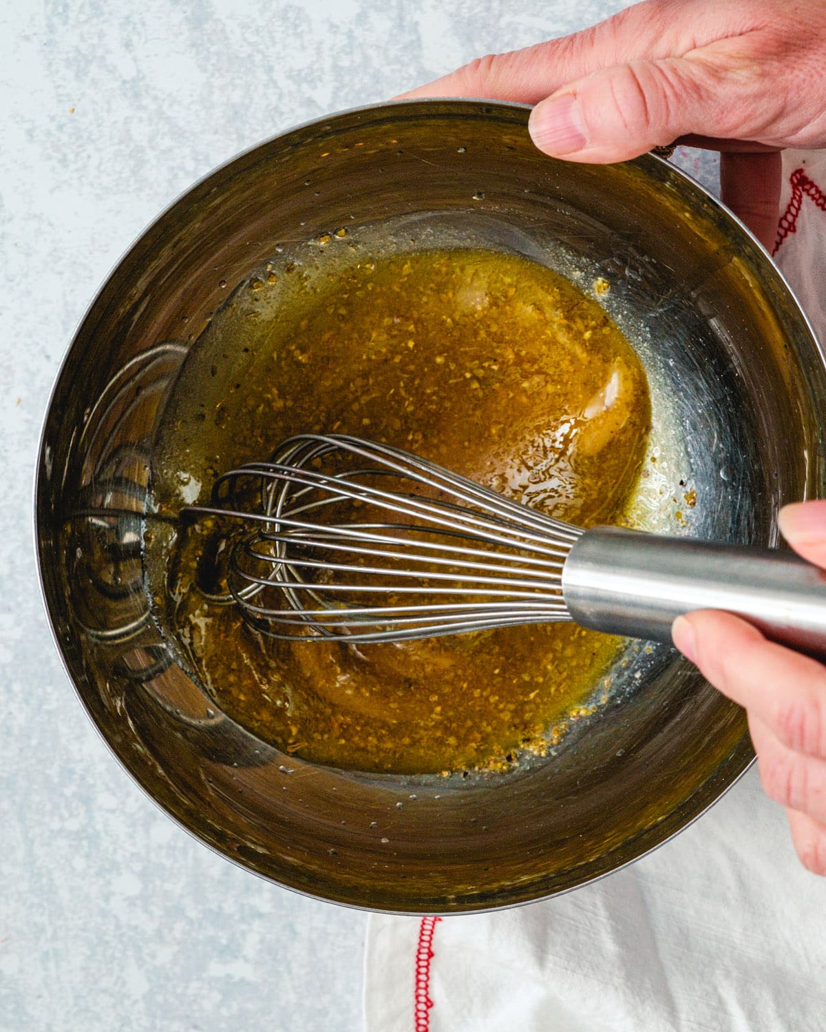 Grilled chicken salad Step 2: Whisk the dressing.