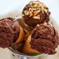 Rich chocolate ice cream in waffle cones.