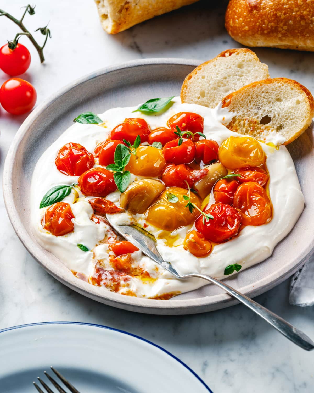 Tomato confit step 3: Serve. If desired, serve over tahini yogurt sauce. 