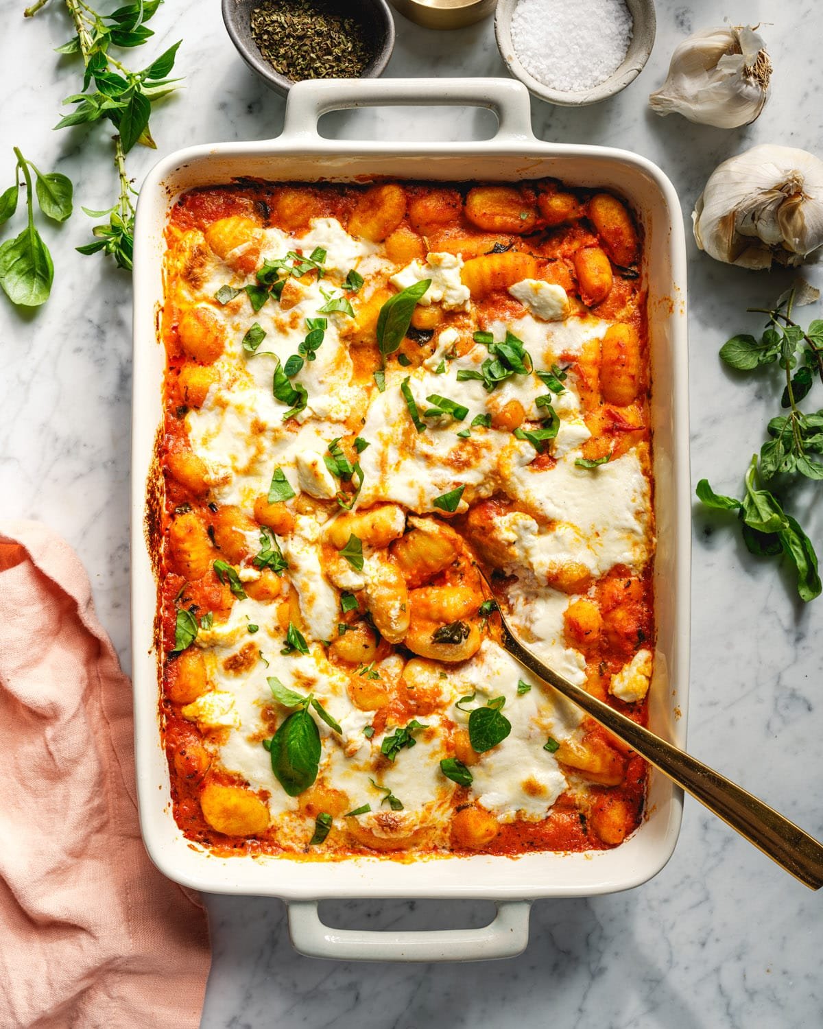 Baked gnocchi in pan with spoon