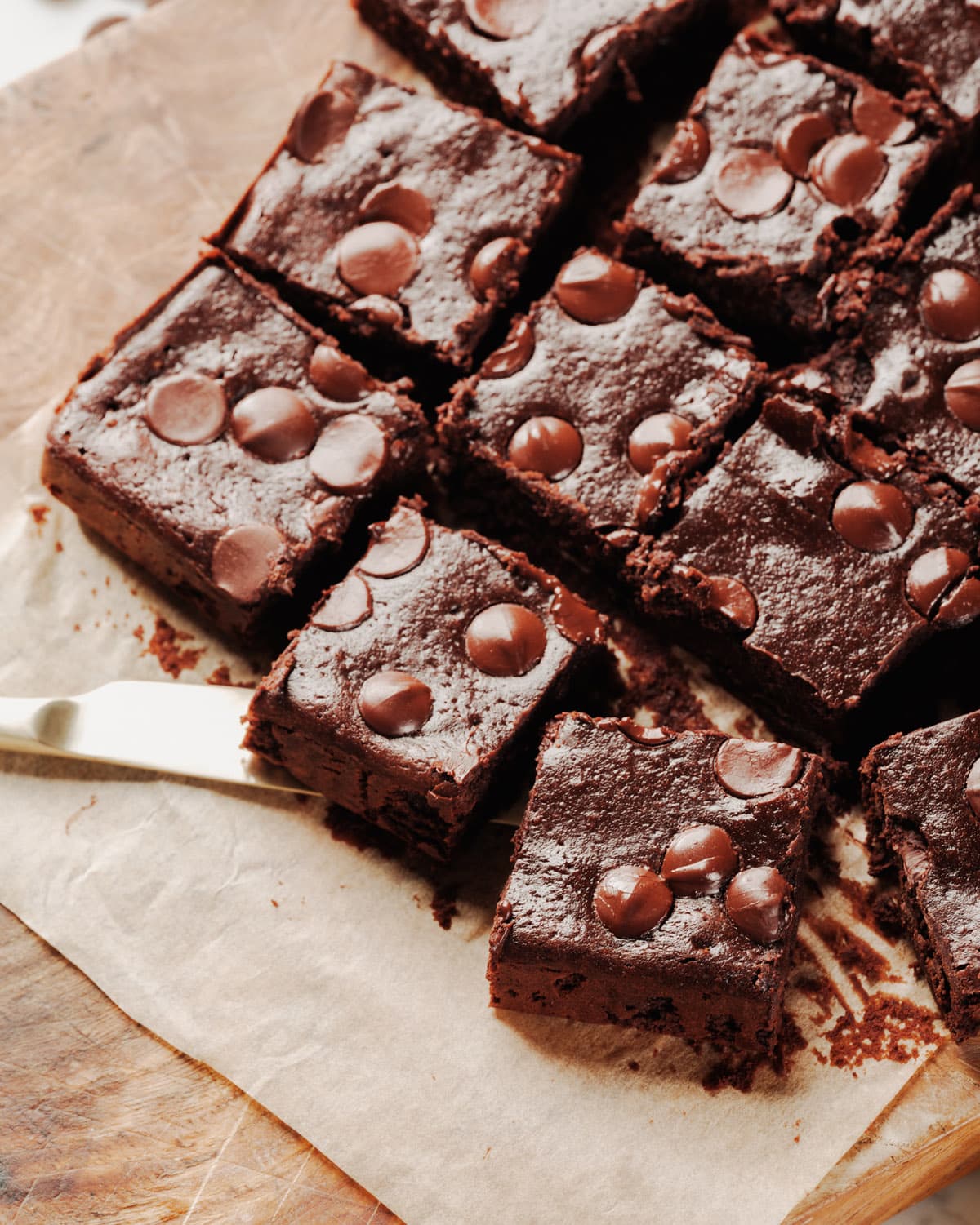 Cottage Cheese Brownies recipe with knife on parchment paper