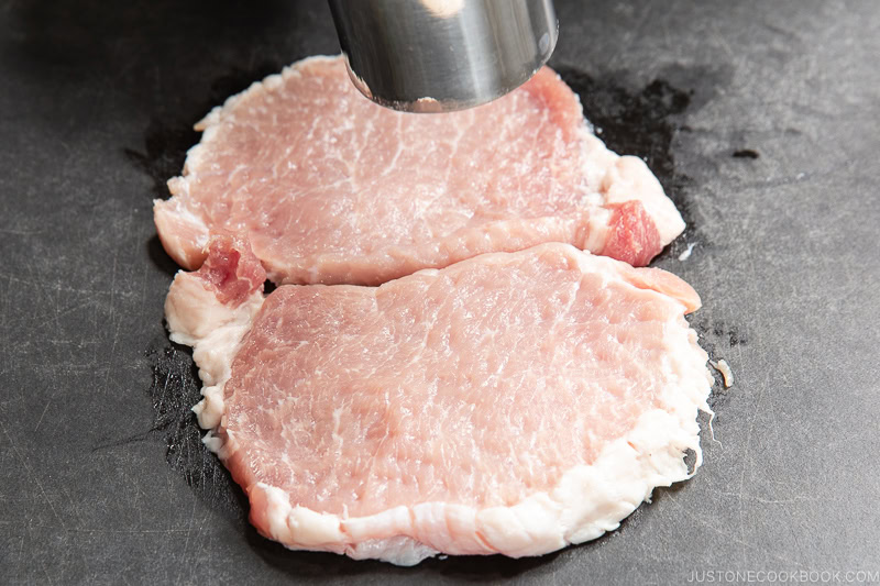 Pound the pork with a meat mallet.