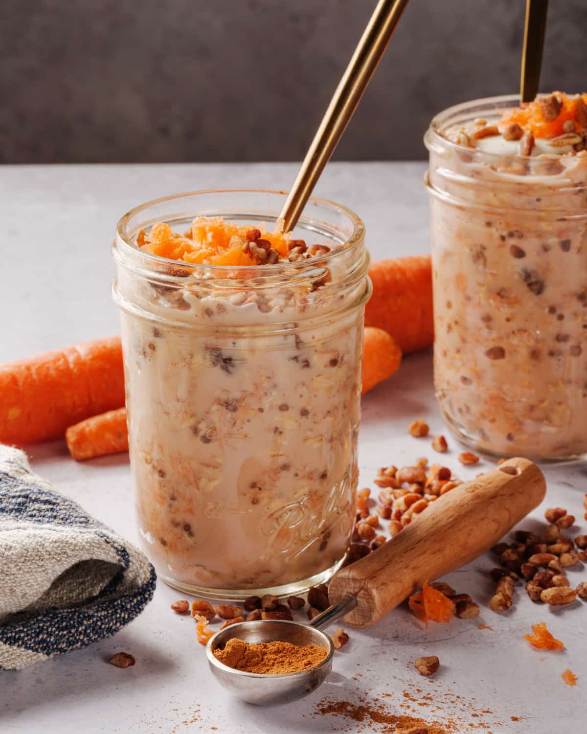 Carrot Cake Overnight Oats in jar with spoon
